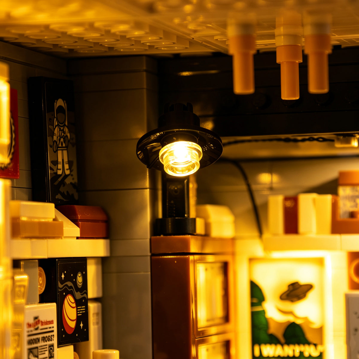 Close-up of the glowing desk lamp and shelves inside the LEGO X-Files office.