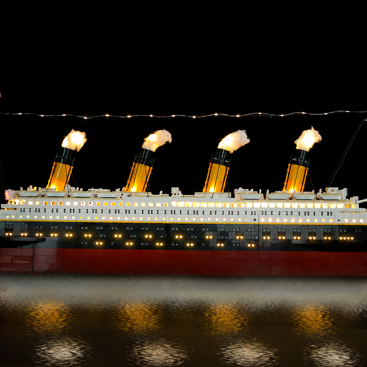 Four funnels of LEGO® Titanic 10294 with the Enhanced lighting.