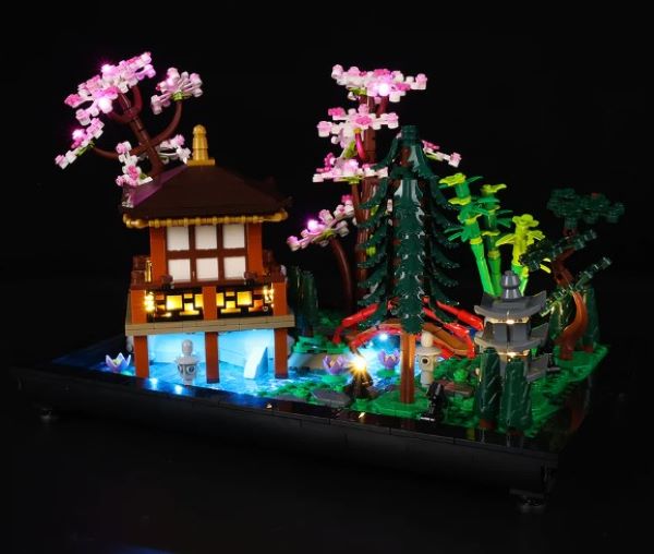 Lighting kit transforms tranquil garden LEGO build.