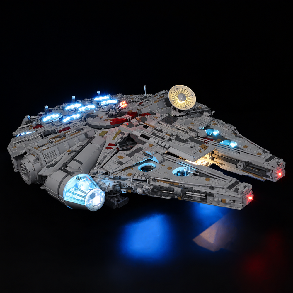 Front three-quarter view of LEGO Millennium Falcon 75192 with a blue-lit cockpit, red front lights and warm interior lighting.