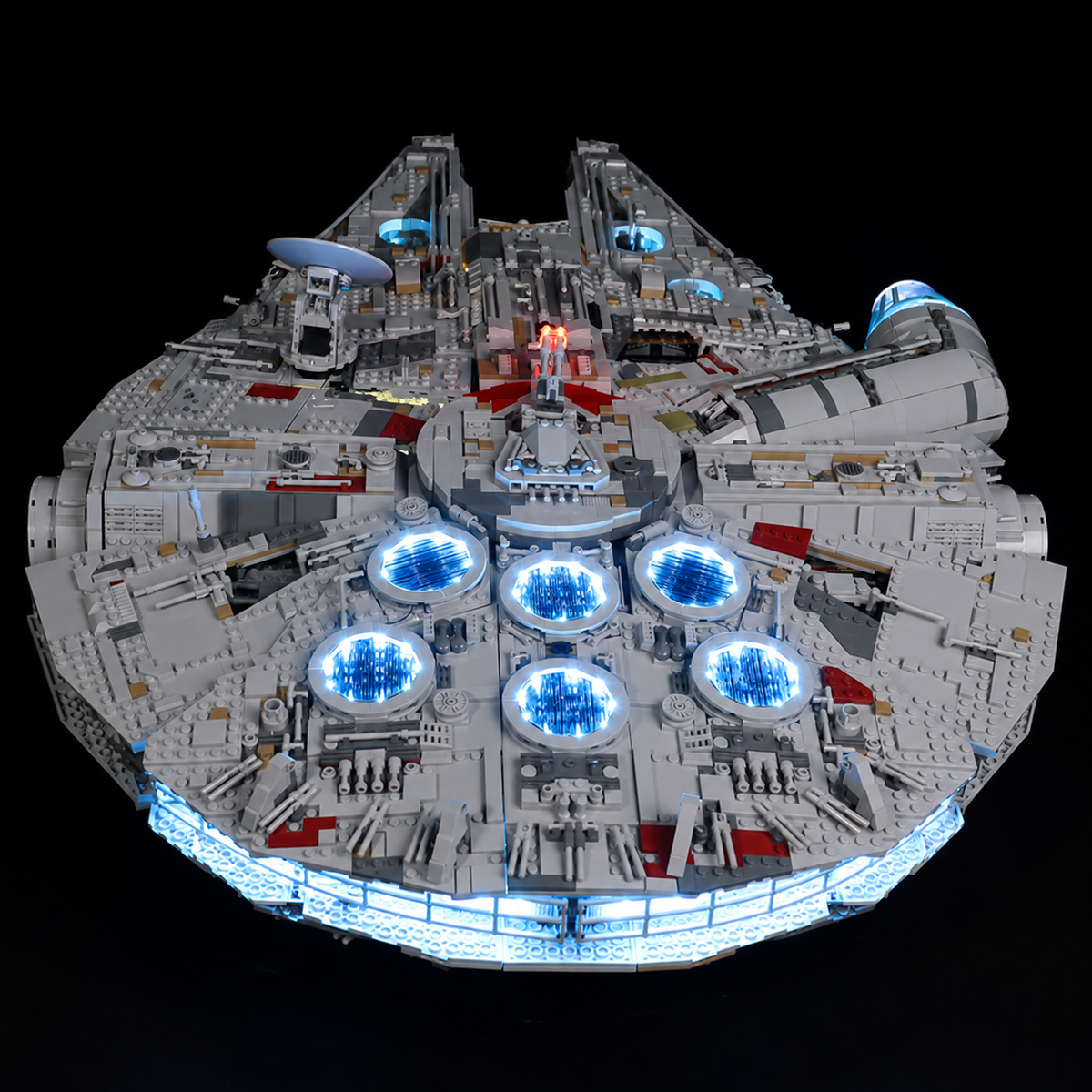 Rear overhead view of LEGO Millennium Falcon 75192 with six blue-lit engine vents and an illuminated rear engine strip.