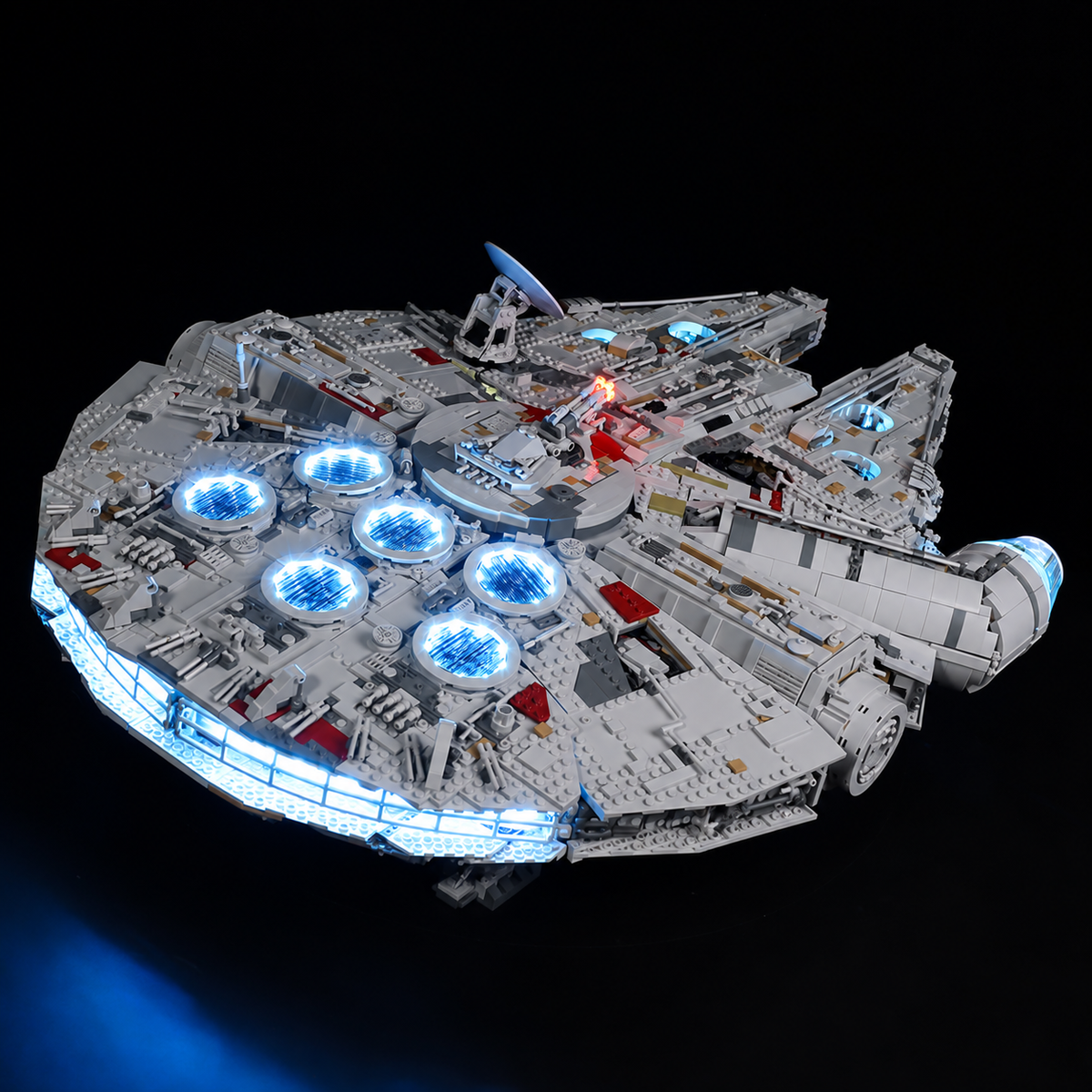 Rear three-quarter view of LEGO Millennium Falcon 75192 showing the blue engine strip and illuminated circular vents.