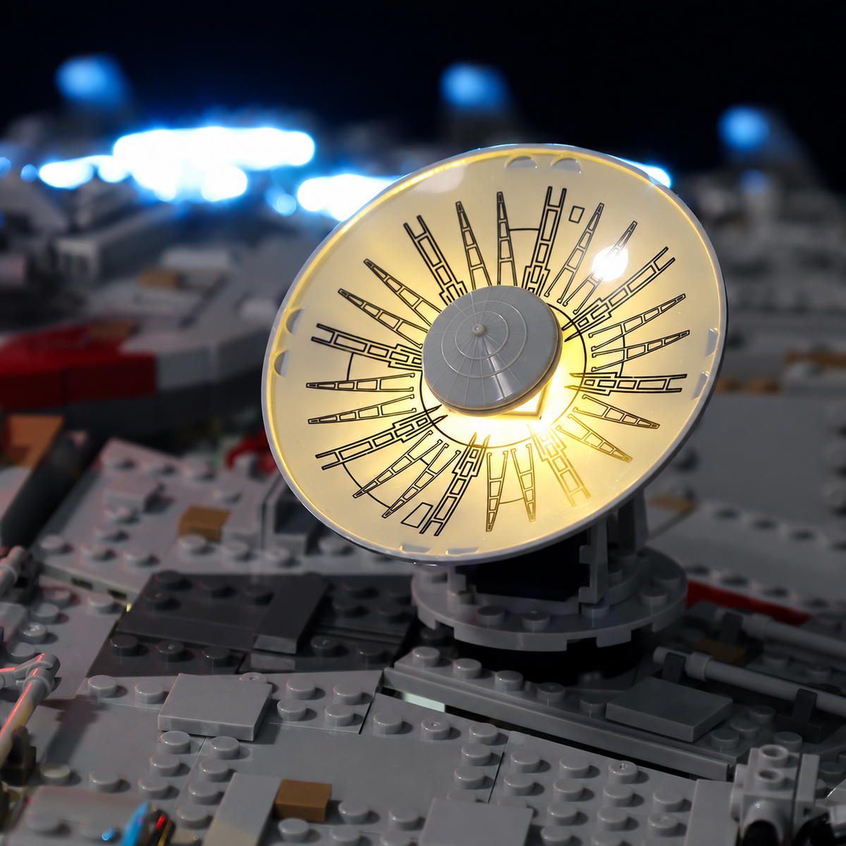 Close-up of the warm-white illuminated radar dish on LEGO Millennium Falcon 75192.