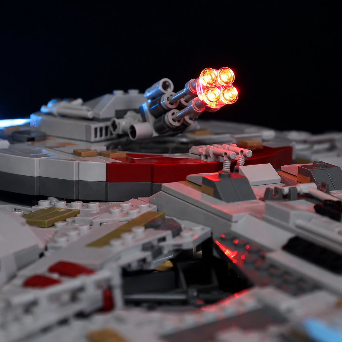 Close-up of the red-orange illuminated quad laser cannon on LEGO Millennium Falcon 75192.