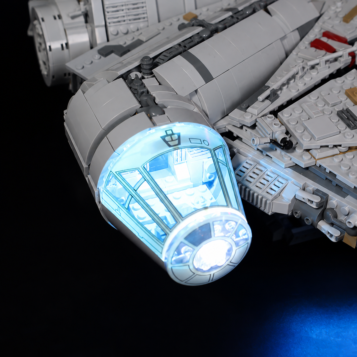 Close-up of the blue-white illuminated cockpit canopy on LEGO Millennium Falcon 75192.