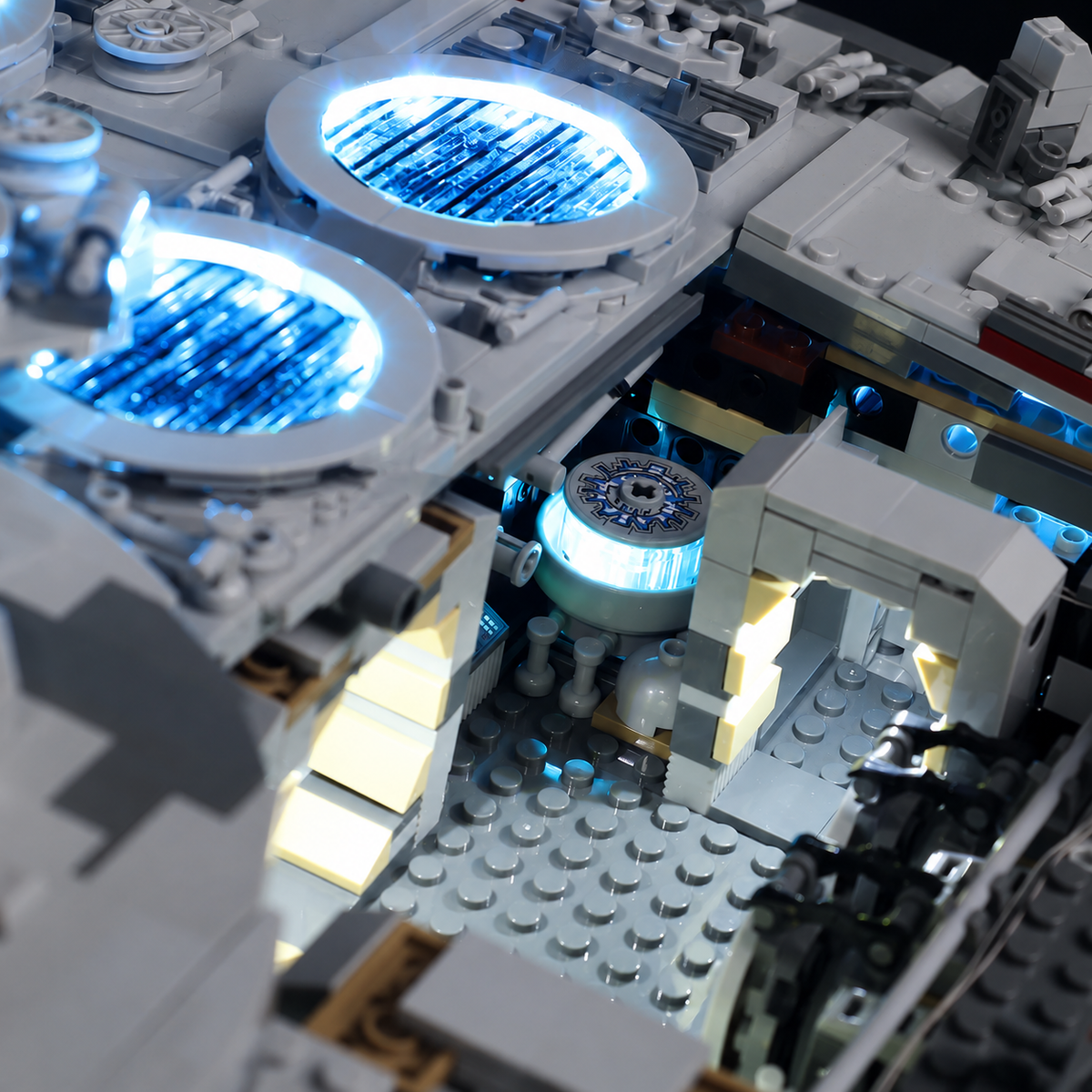 Open rear compartment of LEGO Millennium Falcon 75192 with blue-lit vents and illuminated interior details.