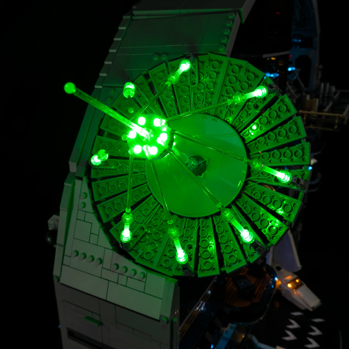 Close-up of the superlaser dish with real green lights around its rim and converging beams