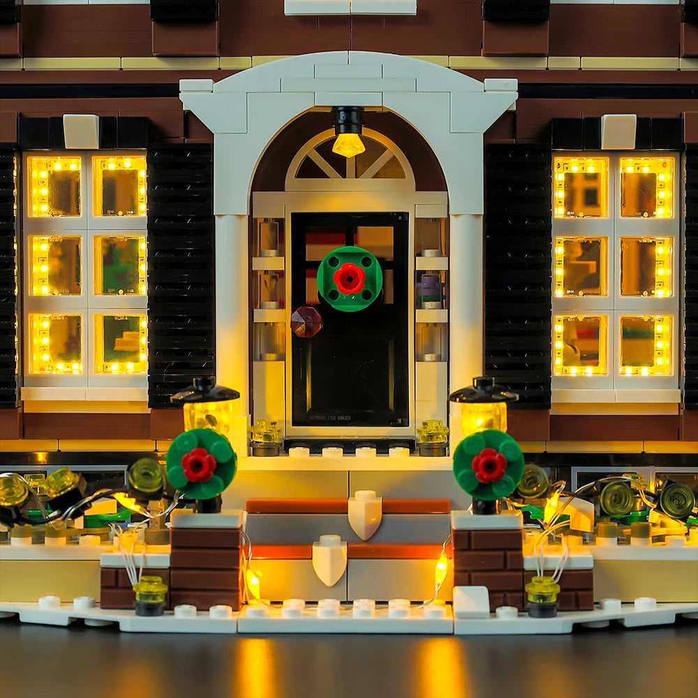 Close-up of the illuminated front door, wreath and front steps