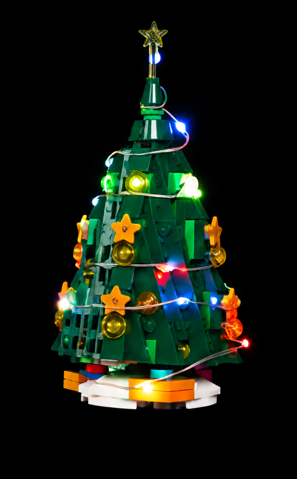Christmas tree from LEGO® Holiday Main Street 10308 with classic lighting against a black background