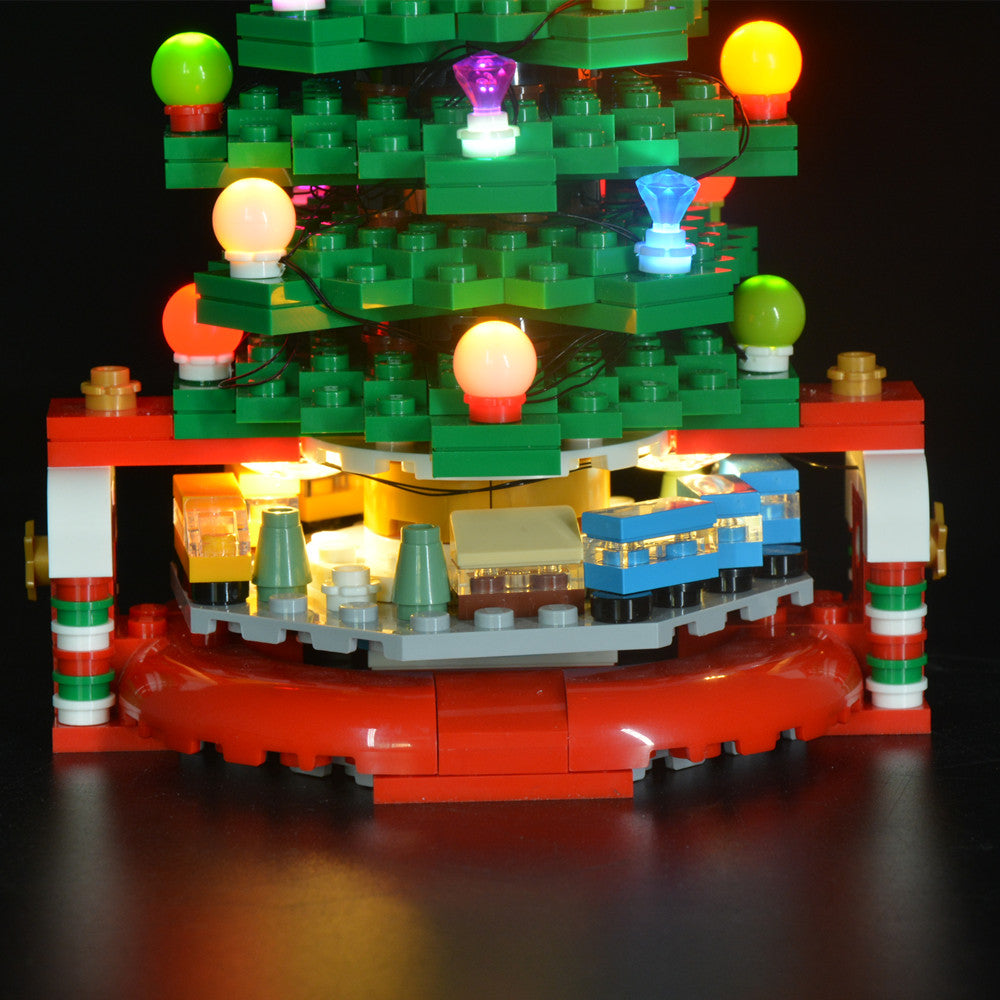 Light Kit for LEGO® Christmas Tree 40338 - close-up of the lower branches and tiny train