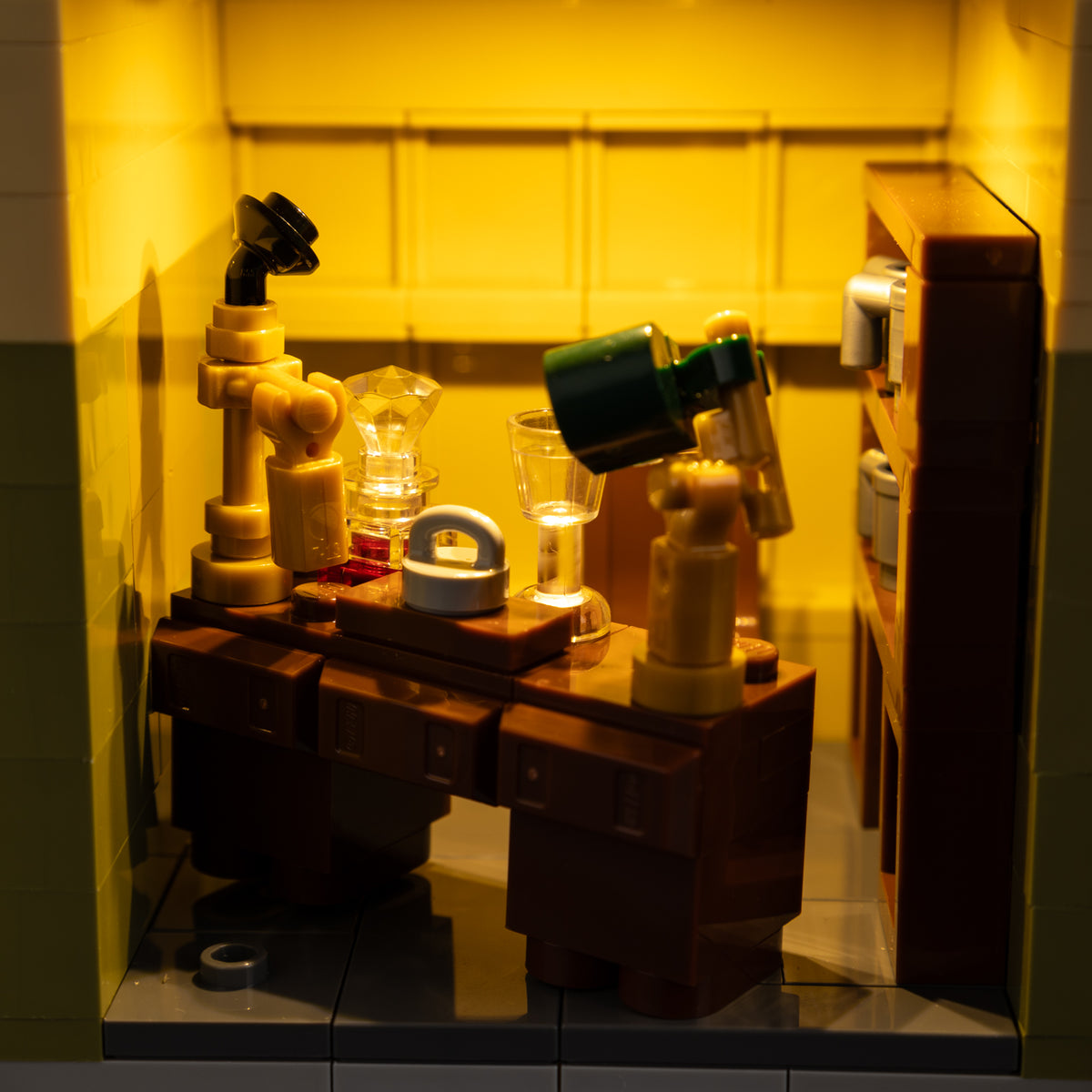 Mr Carson’s office desk and accessories illuminated in warm light