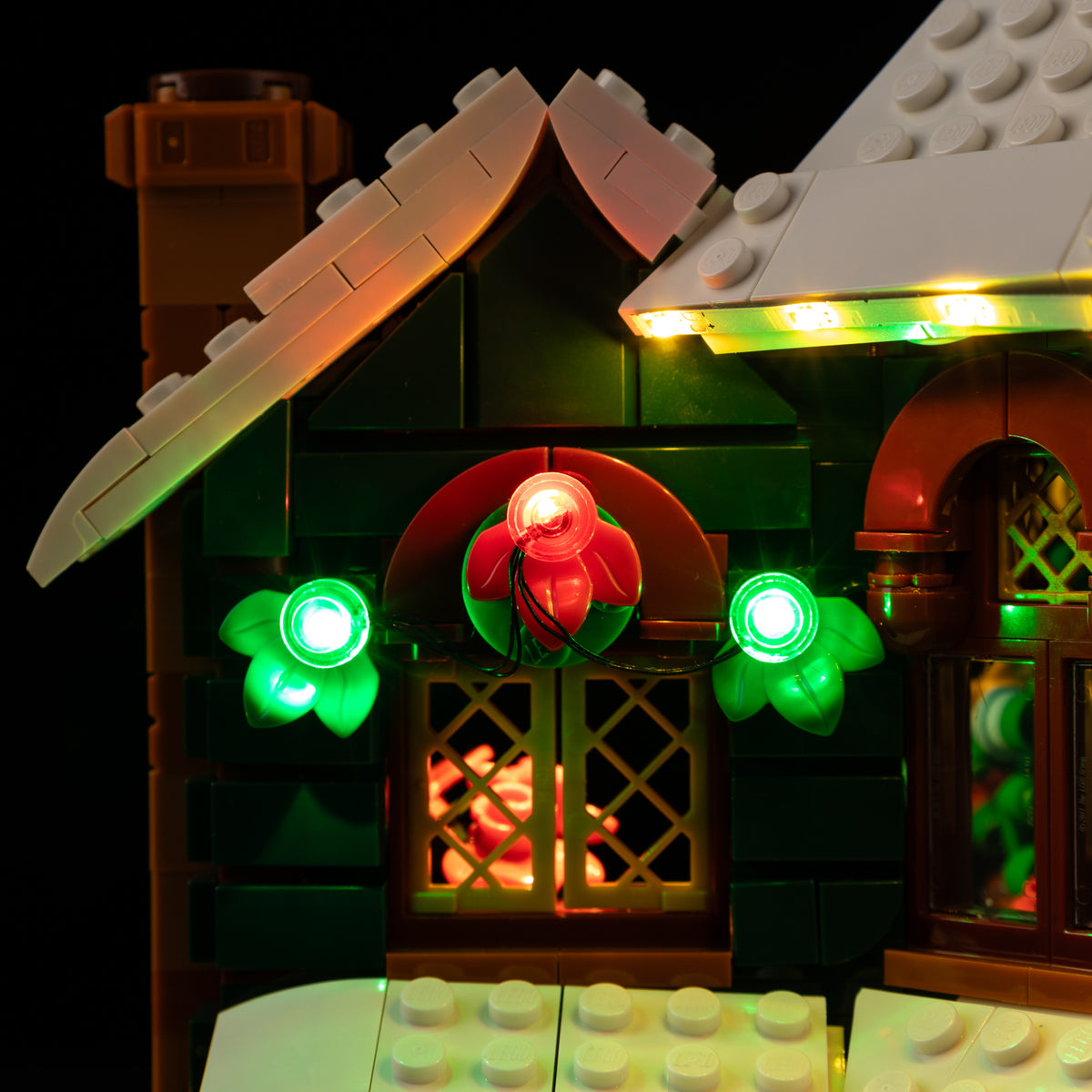 Green and red holly lighting on the Light Kit for LEGO® Holiday House 11387