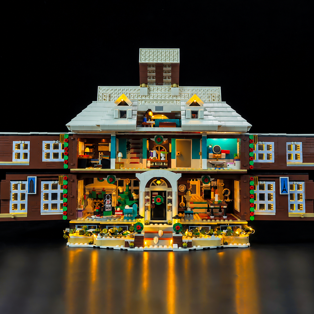 LEGO Home Alone 21330 Christmas Edition opened to show the illuminated rooms and attic.